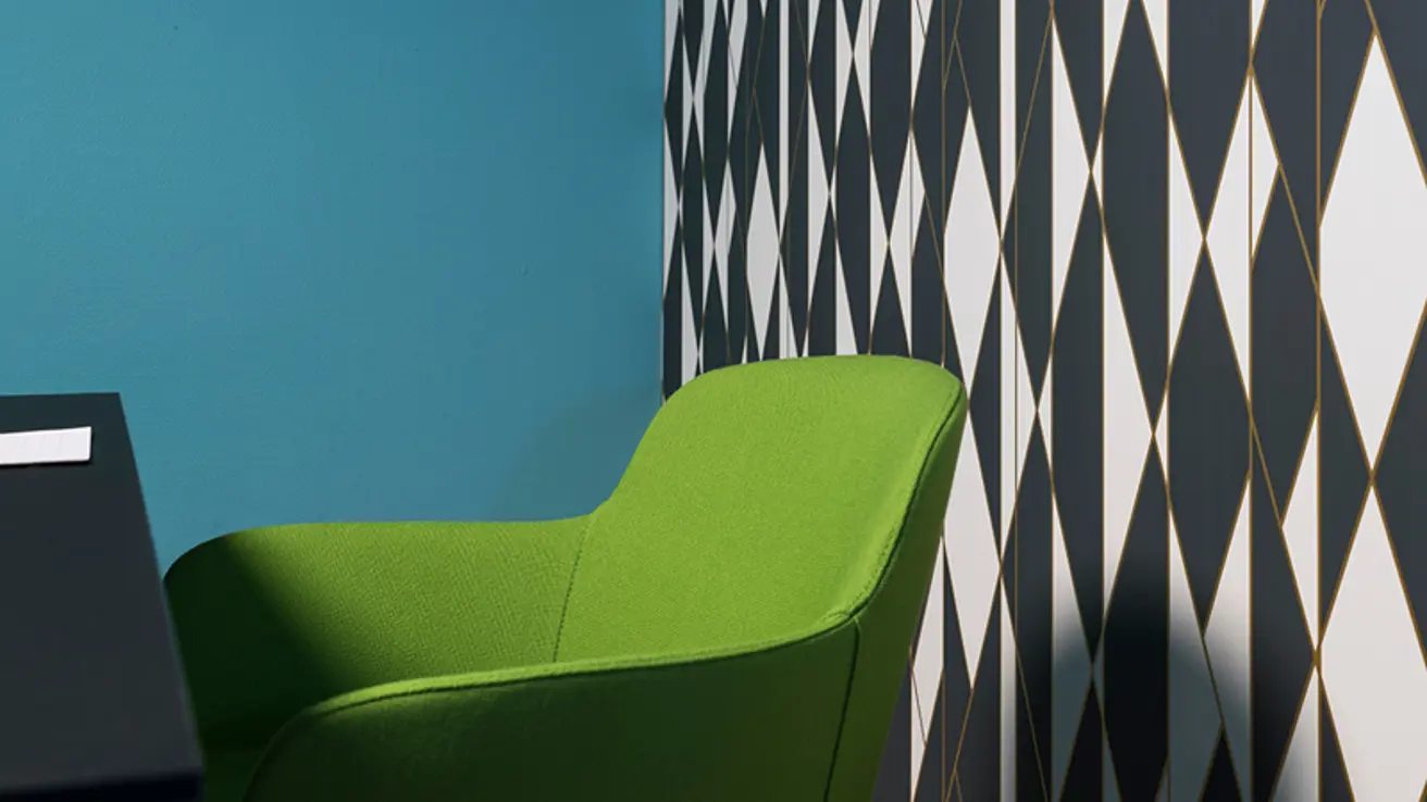 Detaljbildet av en grønn stol