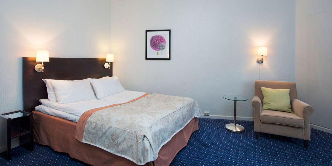 Seng i studioleilighet på Thon Hotel Slottsparken Apartments