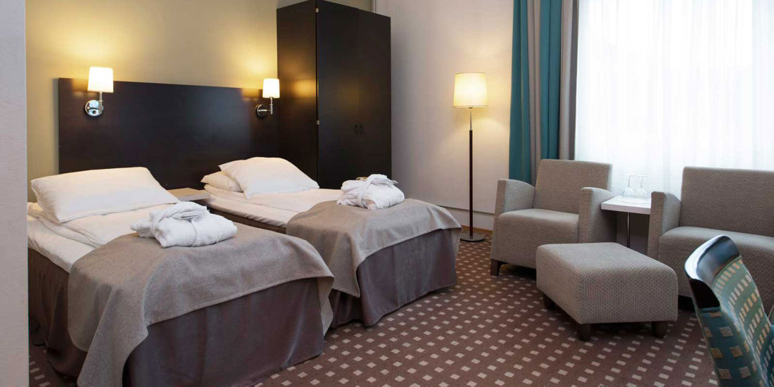 Seng i superior rom på Thon Hotel Ski