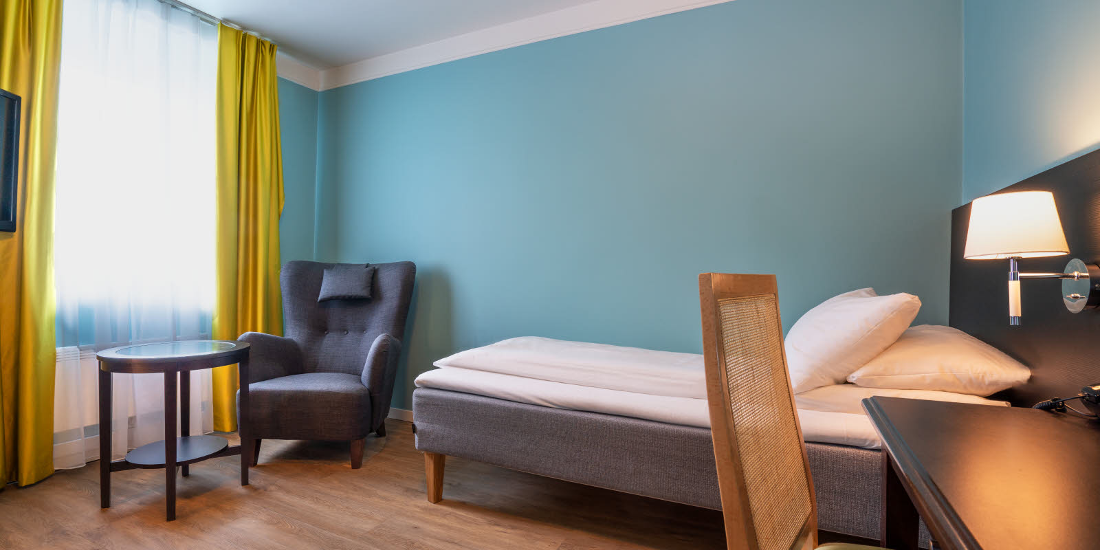 Seng og sitteplass i Standard Room Single p&#xE5; Thon Hotel Linne Apartments