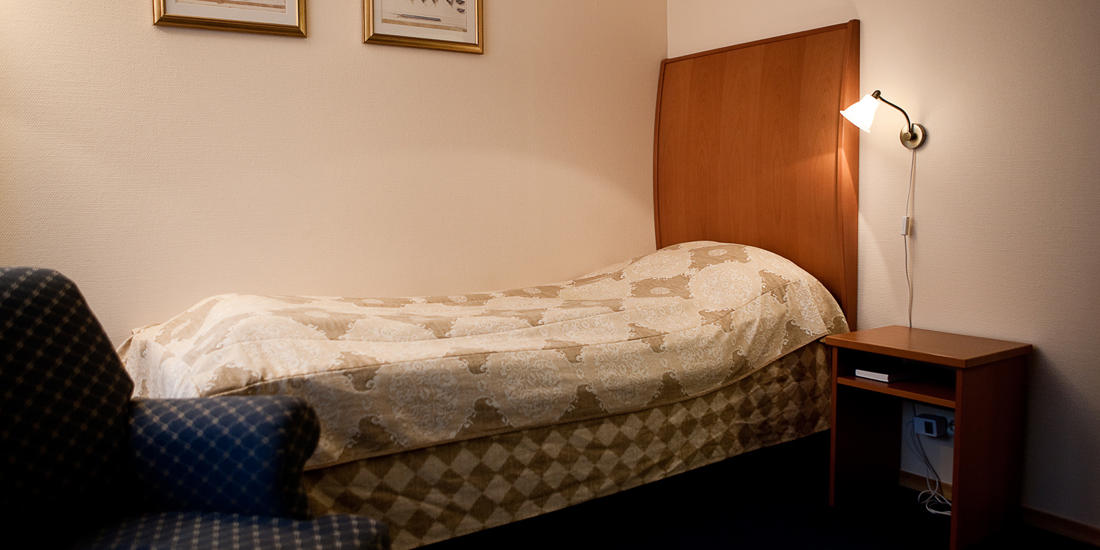 Seng i studioleilighet på Thon Hotel Maritim