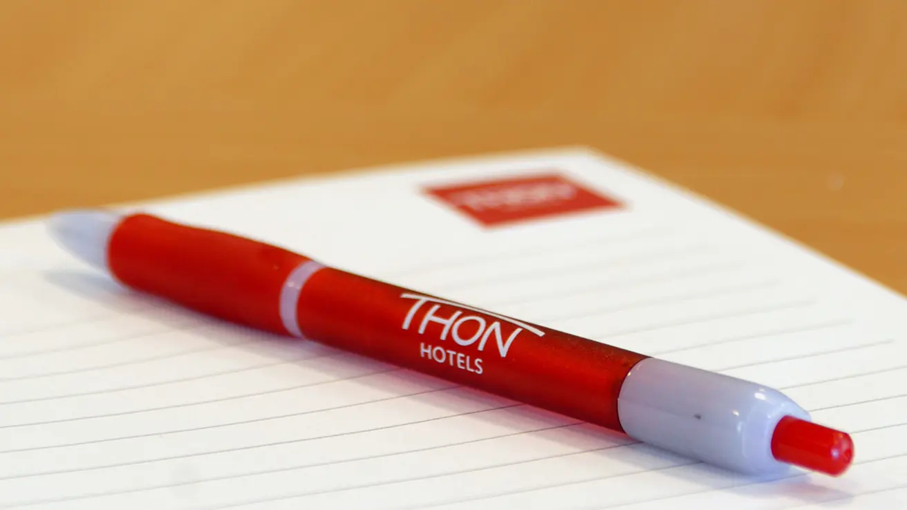 Detaljbilde av penn og notatbok